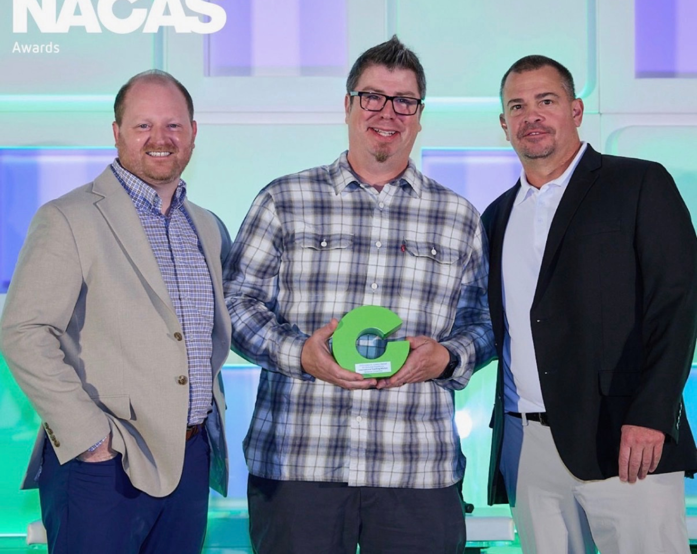Aramark team members pose with an award.